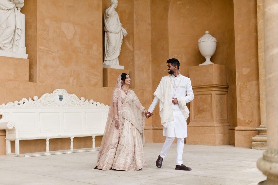 Couple in traditional wedding attire.
